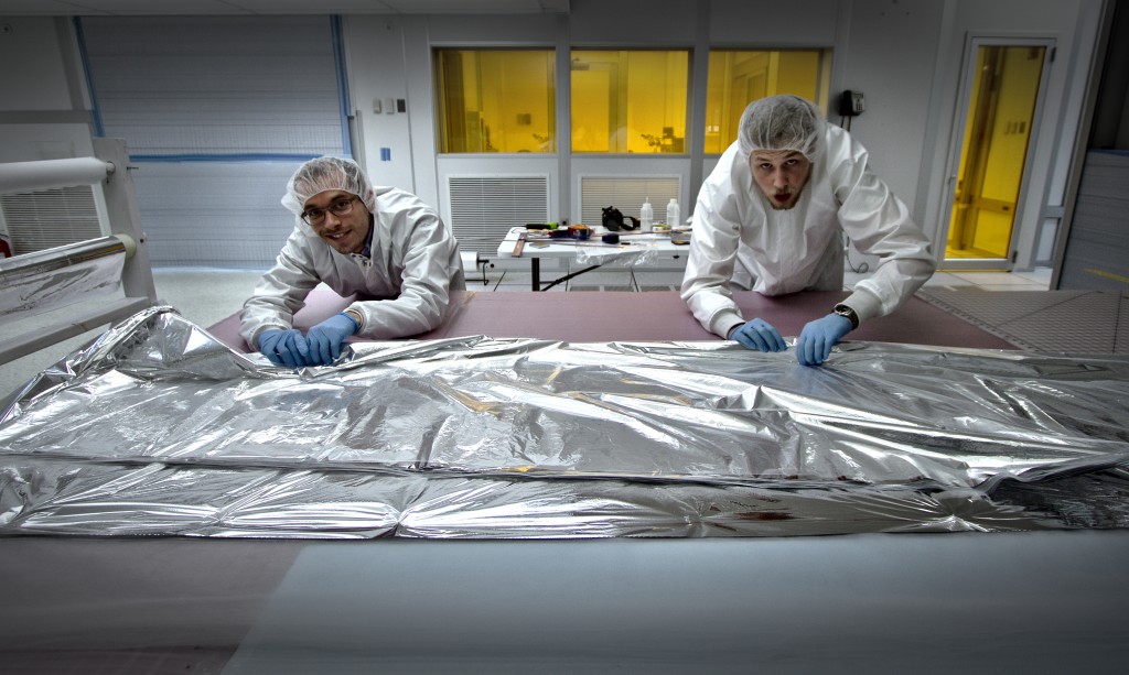 <b>MLI blanket making</b> - The blankets are assembled in a clean-room to reduce particulates, which are unfavorable for vacuum pump-down.